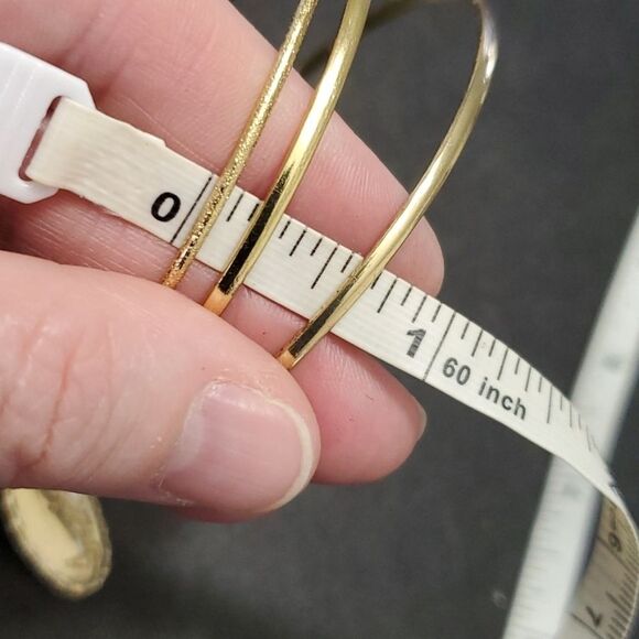 Gold tone layered bracelet with charms - Picture 6 of 9